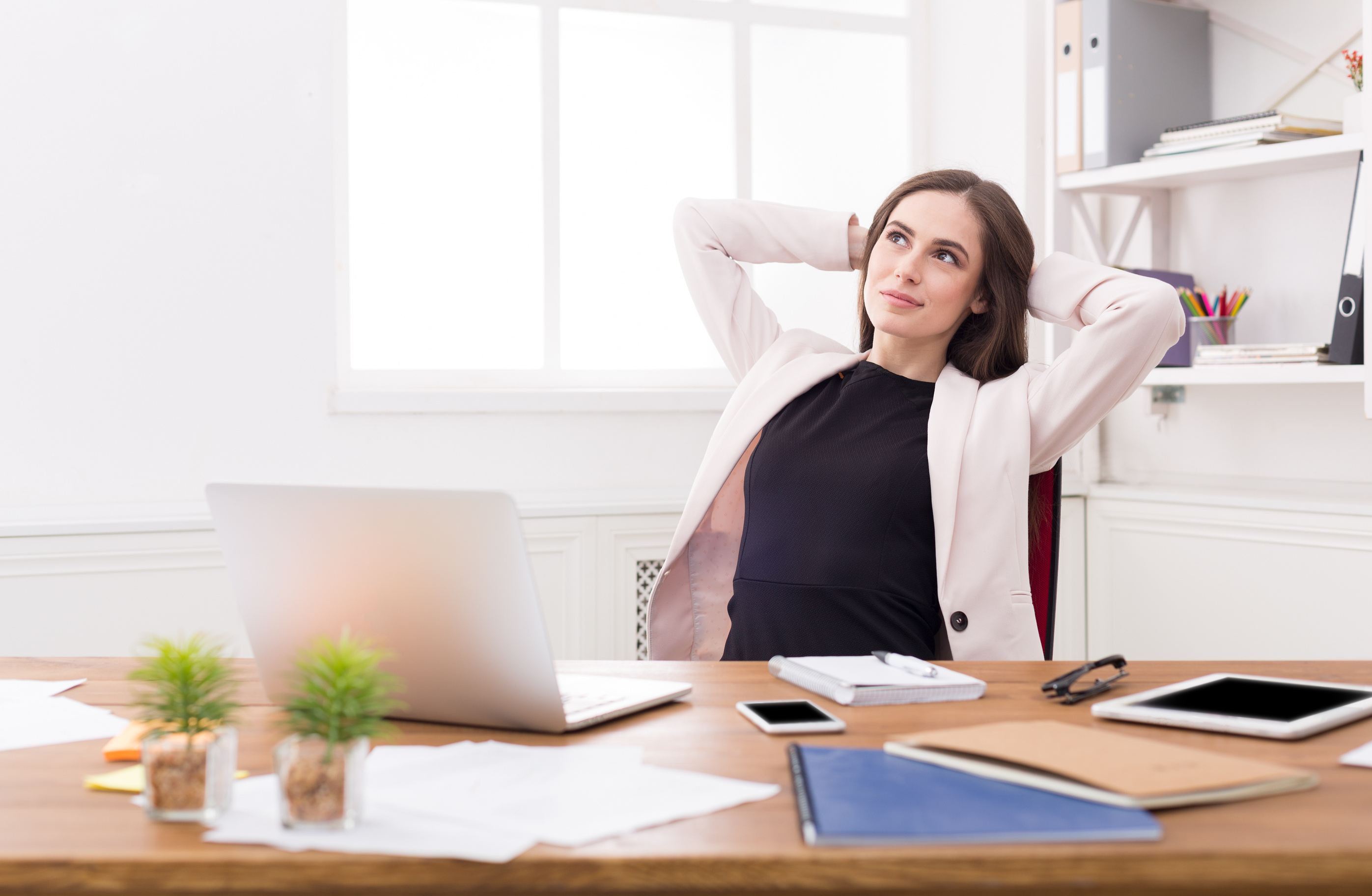 Business woman dreaming about vacation